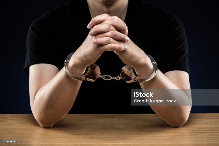 Handcuffed men