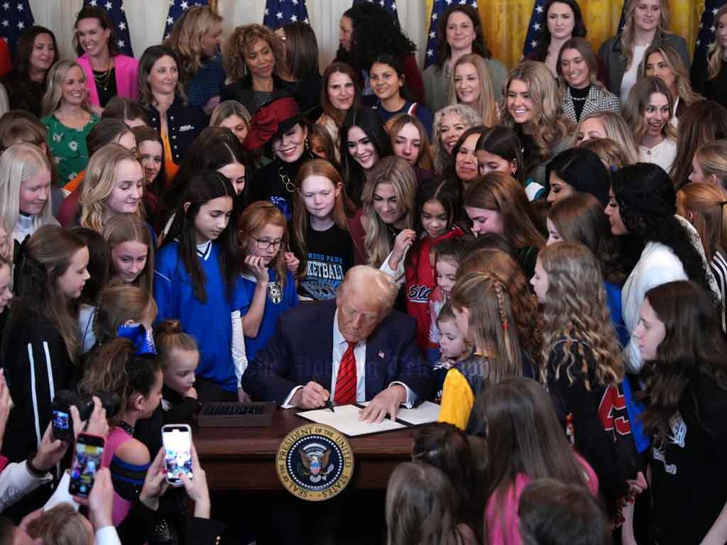 President Donald Trump signed an executive order on Wednesday prohibiting transgender women and girls from competing in female sports. The measure, titled the “No Men in Women’s Sports Executive Order,” is the fourth executive order targeting transgender people that Trump has signed since taking office on January 20. Speaking from a podium at the White House, with dozens of women and girls standing behind him, Trump declared that the executive order was necessary to protect women’s sports from what he called radical leftist ideology. “The radical left has waged an all-out campaign to erase the very concept of biological sex and replace it with a militant transgender ideology,” Trump said. “With this executive order, the war on women’s sports is over.” Trump cited several examples of what he called “men claiming to be girls” stealing victories, including the widely debated case of Algerian female boxer Imane Khelif, who was barred from competing in the Paris Olympics over gender eligibility concerns. Trump, however, falsely claimed that Khelif was assigned male at birth, a claim that has been publicly refuted. What the Executive Order Does White House officials said in a press call on Wednesday morning that the executive order will implement two key policies to enforce the ban on transgender women in women’s sports. First, the order will reverse the Biden administration’s Title IX guidance, which previously required schools receiving federal funding to allow transgender students to compete in sports aligned with their gender identity. Under Trump’s executive order, students assigned male at birth will be barred from participating in girls’ and women’s sports. The Education Department will be responsible for investigating violations, and officials stated they would actively seek cases for review. The new rule will also restrict transgender women from using women’s restrooms and other gender-segregated facilities in schools. Second, the administration plans to work with sports governing bodies, including the International Olympic Committee (IOC), to enforce these policies in non-educational settings. The order also extends to visa policies, meaning that foreign athletes competing in women’s sports in the U.S. may have their gender identity reviewed as part of fraud prevention measures. “If you are coming into the country and claiming that you are a woman but are a male here to compete against women, we’re going to be reviewing that for fraud,” a White House official stated. The timing of the “No Men in Women’s Sports Executive Order” coincides with the 39th annual National Girls & Women in Sports Day, an event first established in 1987 to celebrate female athletes and inspire young girls to participate in sports. Political and Public Reaction The issue of transgender women in sports has been one of the most divisive topics in American politics, especially leading up to the November election. Trump repeatedly criticized the inclusion of trans athletes in women’s sports, referring to trans women as “men” and promising to ban their participation. A Gallup poll from May 2023 showed that nearly 70% of Americans believe transgender athletes should only compete on teams that correspond with their birth sex, a rise from 62% in 2021. According to the Movement Advancement Project, an LGBTQ think tank, 27 states already have laws, regulations, or policies banning transgender students from participating in sports consistent with their gender identity. Support and Opposition The executive order has drawn both praise and criticism from various groups. Schuyler Bailar, a former Harvard University swimmer and the first openly transgender athlete to compete in Division I men’s sports, condemned the order, calling it “absolutely devastating” and a direct attack on transgender rights. “This is a really horrible way to invite a lot of discrimination — not just against trans people but also against all people in the women’s category, because this is a policing of women’s bodies in sports,” Bailar, 28, said. On the other hand, Riley Gaines, a former college swimmer who has been a vocal opponent of trans women competing in women’s sports, praised the order. Gaines, who attended the signing ceremony, wrote on X (formerly Twitter): “Things could’ve been so different. Gender insanity was the final straw that brought a lot of moderates to the side of common sense. Specifically, I believe it was the issue of men in women’s sports. I’ve been living in a state of gratitude every day since Nov 5th. Praise God.” Several LGBTQ rights organizations have strongly opposed the executive order. Carl Charles, a senior attorney for Lambda Legal, called it "appalling and discriminatory." "We are appalled, and in fact disgusted, at this administration’s insatiable appetite for fearmongering about and relentless targeting of this most vulnerable population," Charles said. He added that many states with trans athlete bans are already facing lawsuits, and courts have blocked similar laws in Arizona, Idaho, Utah, and West Virginia. Trump’s Broader Policies Targeting Transgender People The sports ban is the fourth executive order Trump has signed targeting transgender people since his return to office. On Inauguration Day, Trump signed an order stating that the U.S. government would recognize only two sexes—male and female—and that these sexes “are not changeable.” He also signed an order reinstating a ban on transgender people serving openly in the U.S. military and restricting access to gender-affirming medical care for transgender individuals under 19 years old nationwide. Legal Challenges Expected Like many state-level bans on trans athletes, the executive order is expected to face legal challenges. Several federal courts have ruled against similar policies, and legal experts argue that the order may violate Title IX’s broader protections against sex-based discrimination. Despite the likelihood of legal battles, Trump has made it clear that he sees transgender issues as a key part of his political agenda. As the November election approaches, the debate over transgender rights—especially in sports, healthcare, and the military—is expected to remain at the center of national discourse.