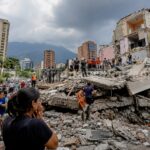 Rescue workers searching through rubble during the Venezuela earthquake crisis in La Guaira