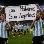 Lisandro Martínez and Giovani Lo Celso displaying the Argentina Falklands banner after defeating England