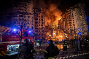 Emergency crews respond after the Kyiv ballistic missile attack damaged residential and commercial buildings