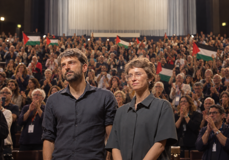 Standing Ovation Amid Palestinian Flags